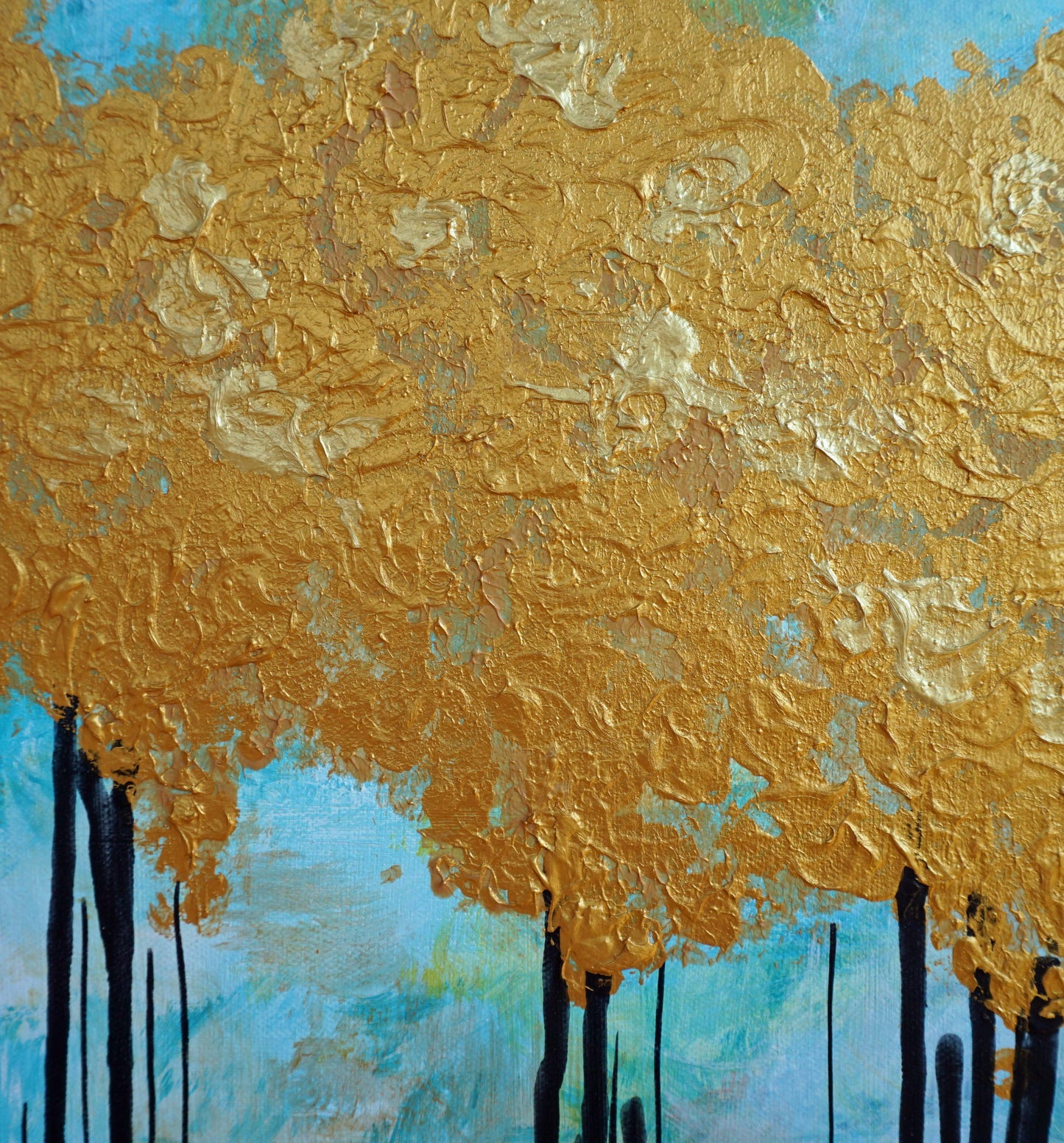 Home decor art gold and blue trees painting details.